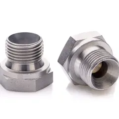 Dwa metalowe elementy z gwintem BSPT, gotowe do połączenia.